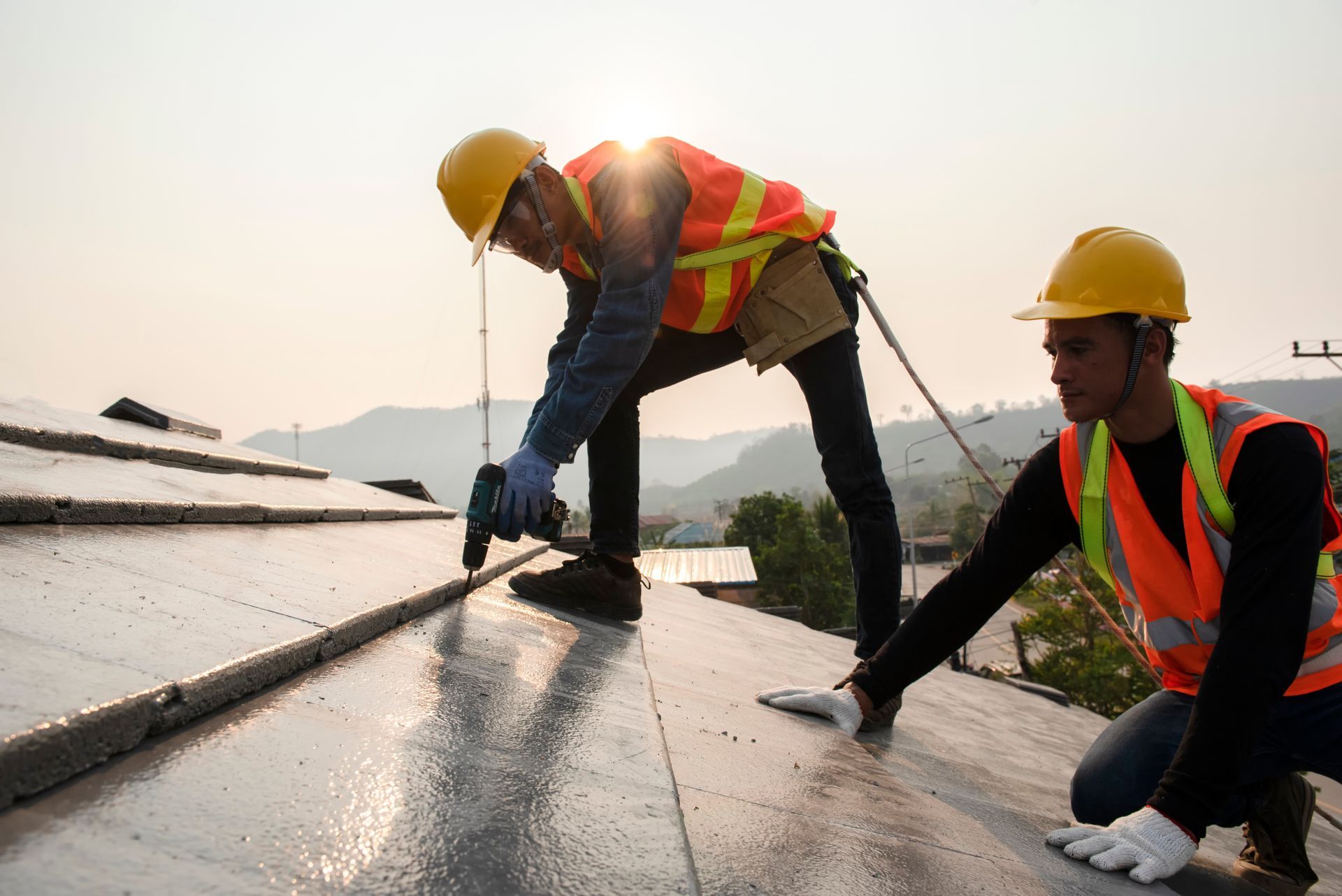 The roof work team in work clothes and special protective gloves.
