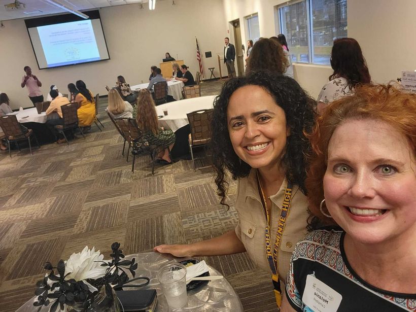 two women at conference taking selfie