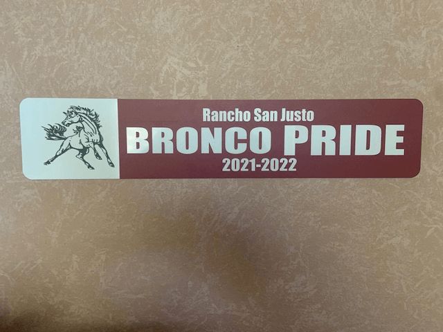 A brown and white rancho san justo bronco pride sticker