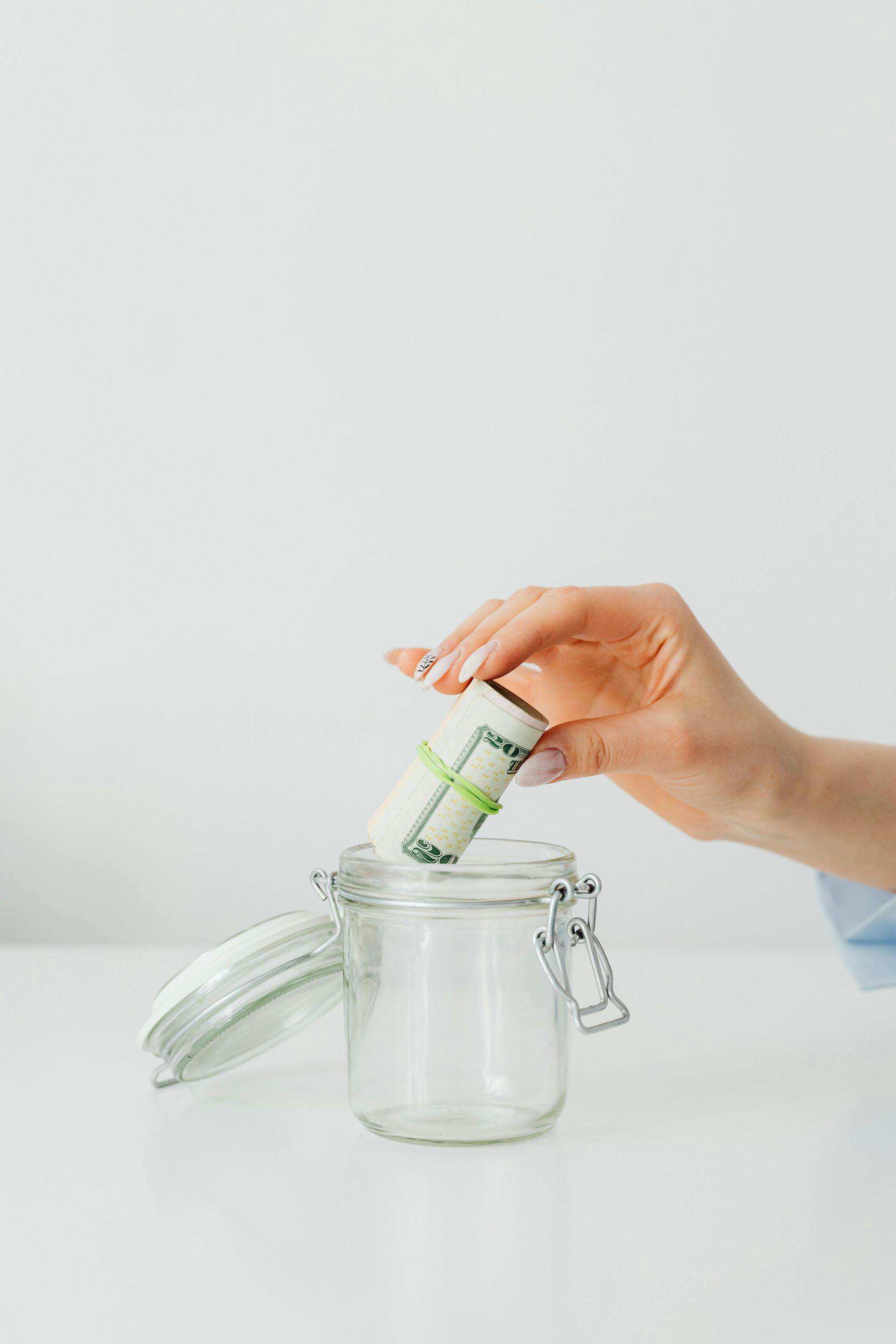 photo of putting money in a jar