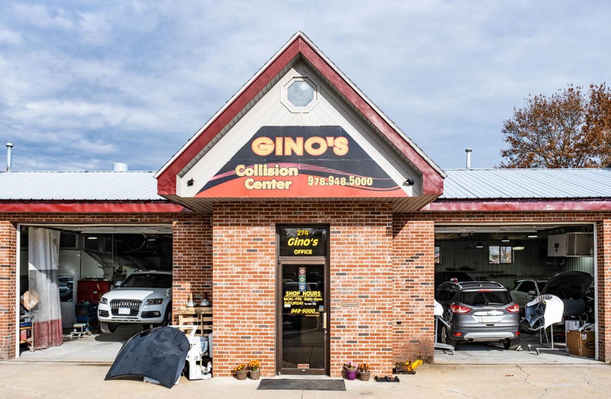 Gino's Collision Center storefront and service bays in Rowley, MA