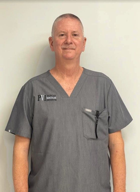 David Webb, Vascular Radiology Tech, a man wearing a scrub top with paducah vascular institute logo on it