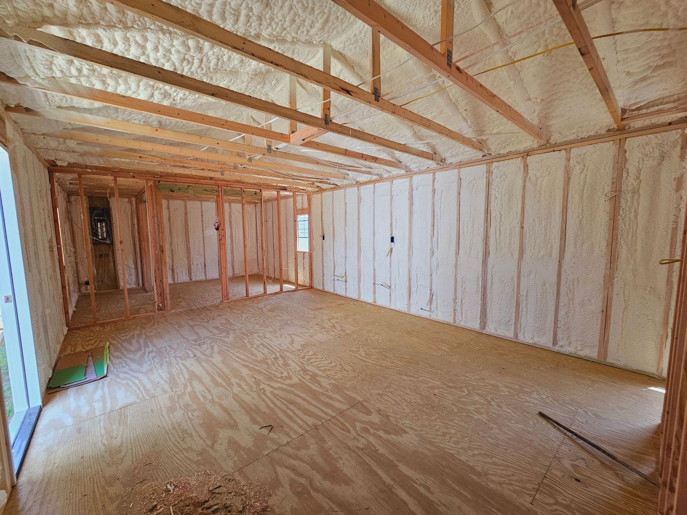 A large room with a lot of insulation on the walls and ceiling.