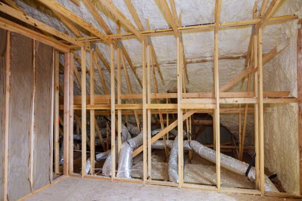 A room with a lot of wooden beams and pipes in it.