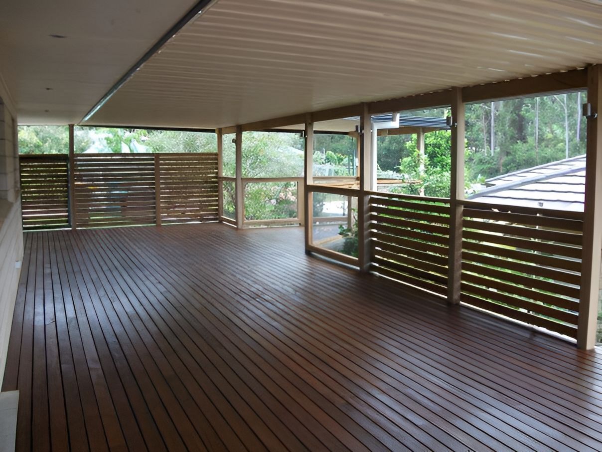 A large wooden deck with a fence around it - Mark Cannon Carpentry & Maintenance in Moonee Beach, NSW