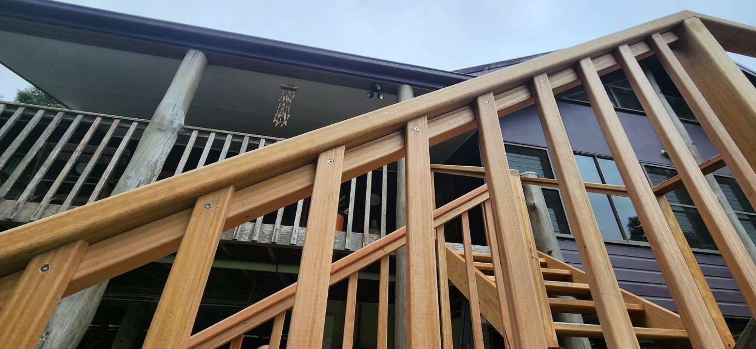 A Wooden Staircase Leading Up to a House — Mark Cannon Carpentry & Maintenance in Moonee Beach, NSW