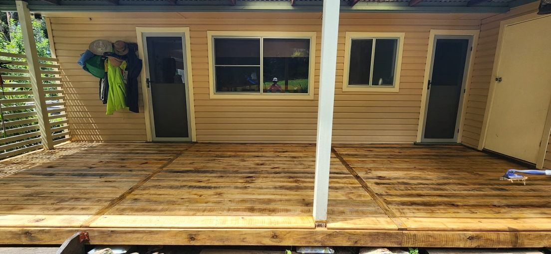 There is a Wooden Deck in Front of a House — Mark Cannon Carpentry & Maintenance in Moonee Beach, NSW