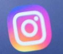 Instagram app icon, a rounded square with a gradient of colors and a white camera outline.