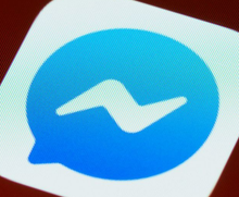 Blue Messenger app icon with white lightning bolt.