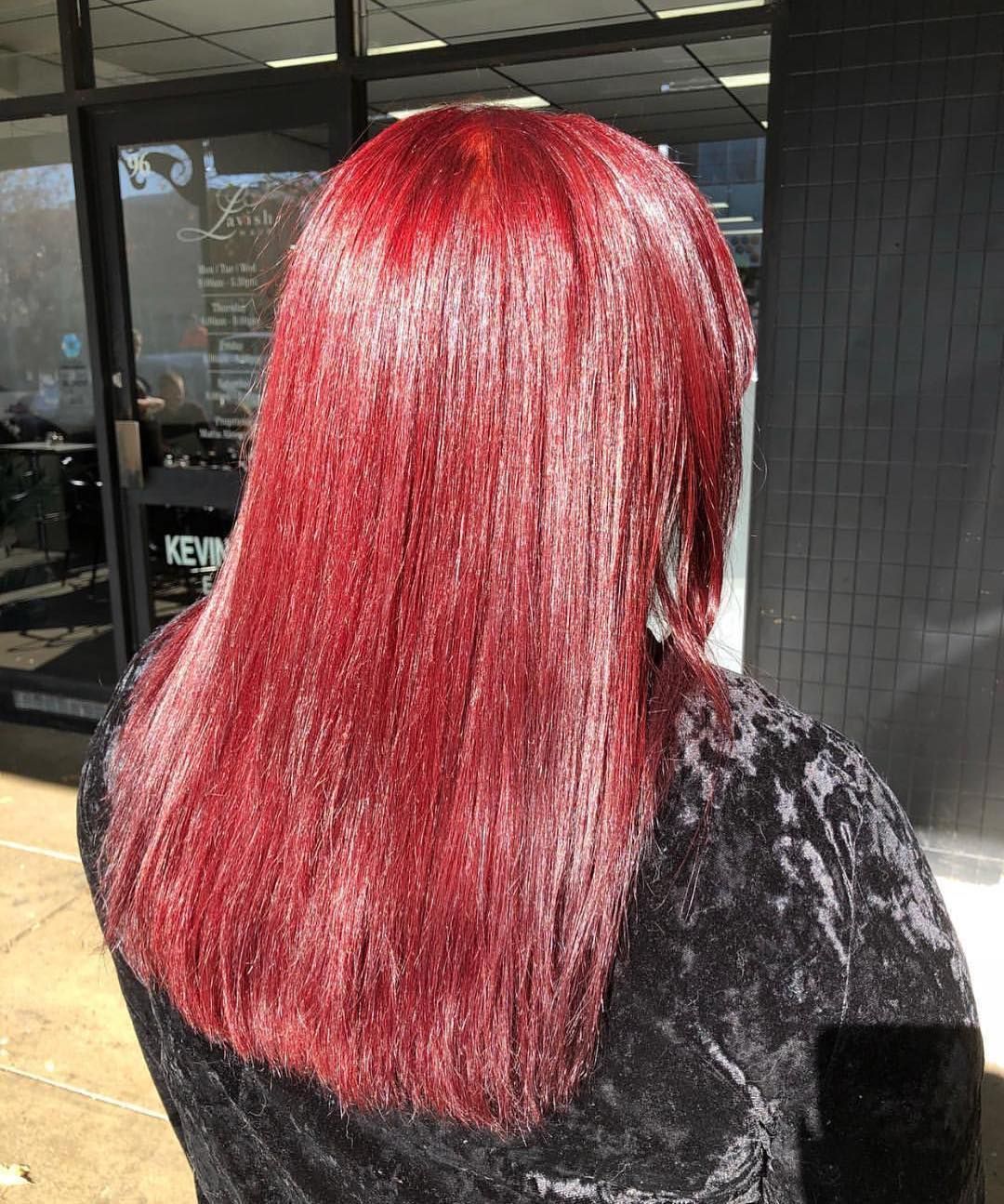 Woman With Long, Straight, Red Hair Stands Outside a Salon — Lavish Hair in Shepparton, VIC