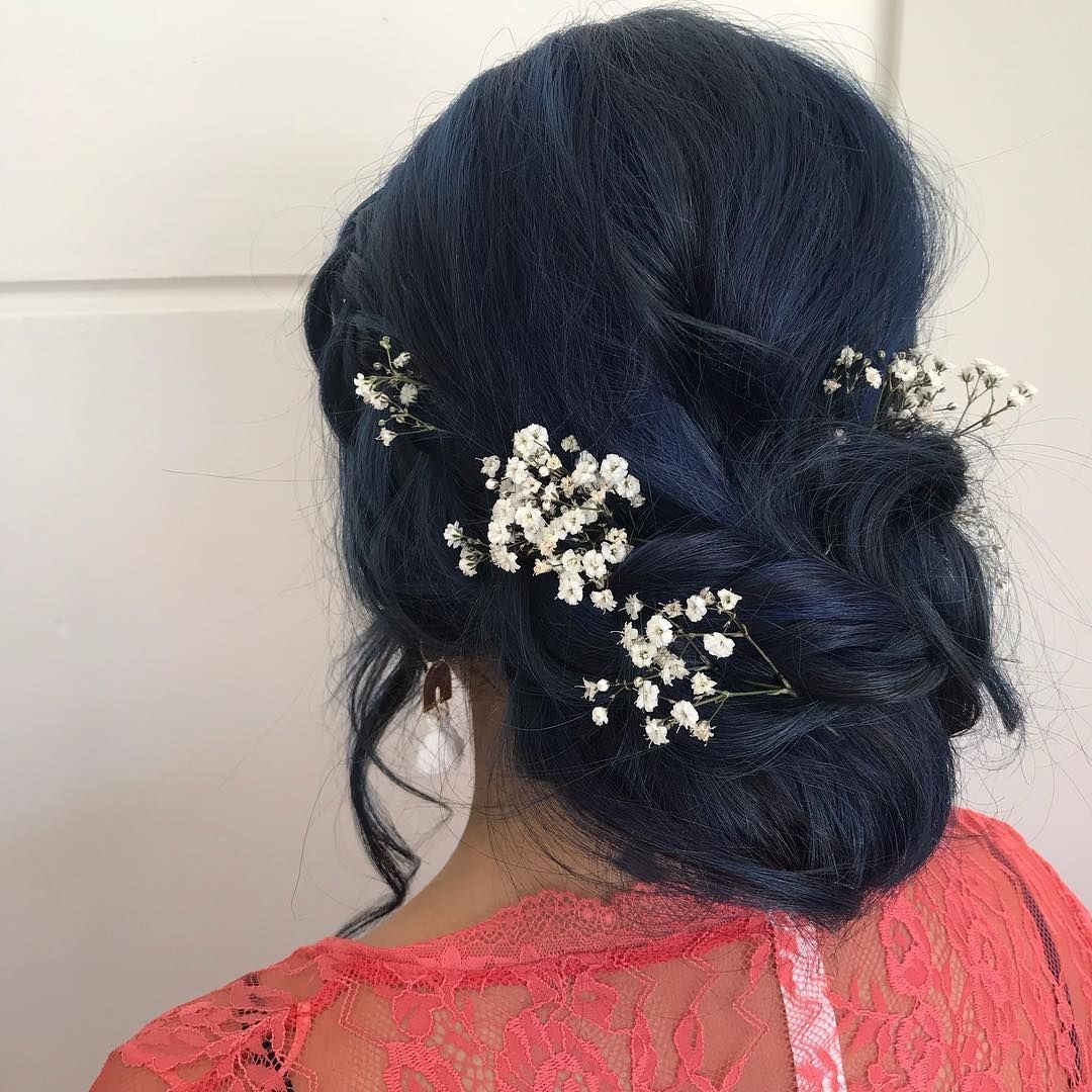 Woman With Navy Blue Updo Hairstyle Adorned With White Flowers — Lavish Hair in Shepparton, VIC