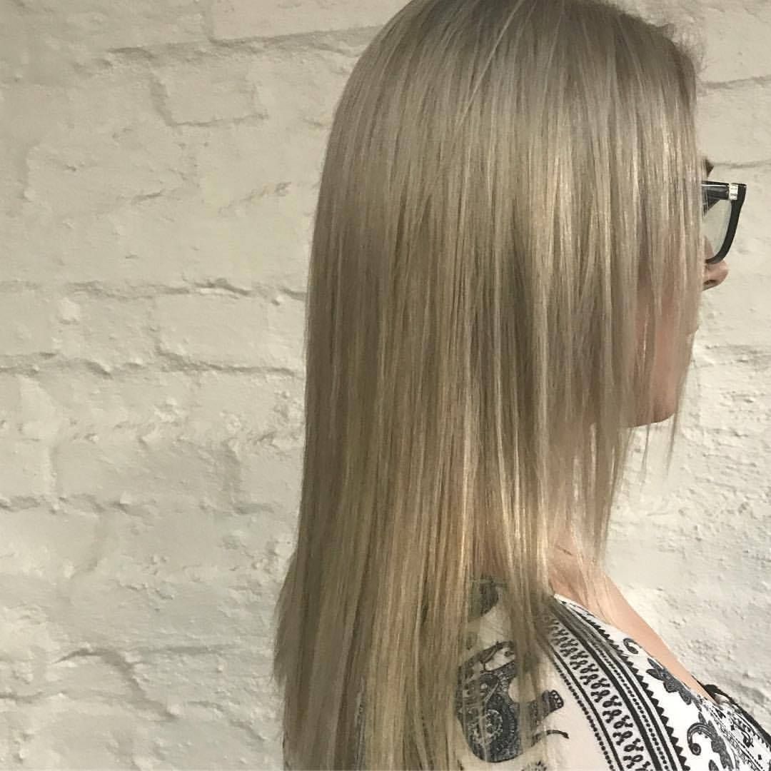 Woman With Straight, Platinum Blonde Hair, Glasses, and a Floral Tattoo — Lavish Hair in Shepparton, VIC