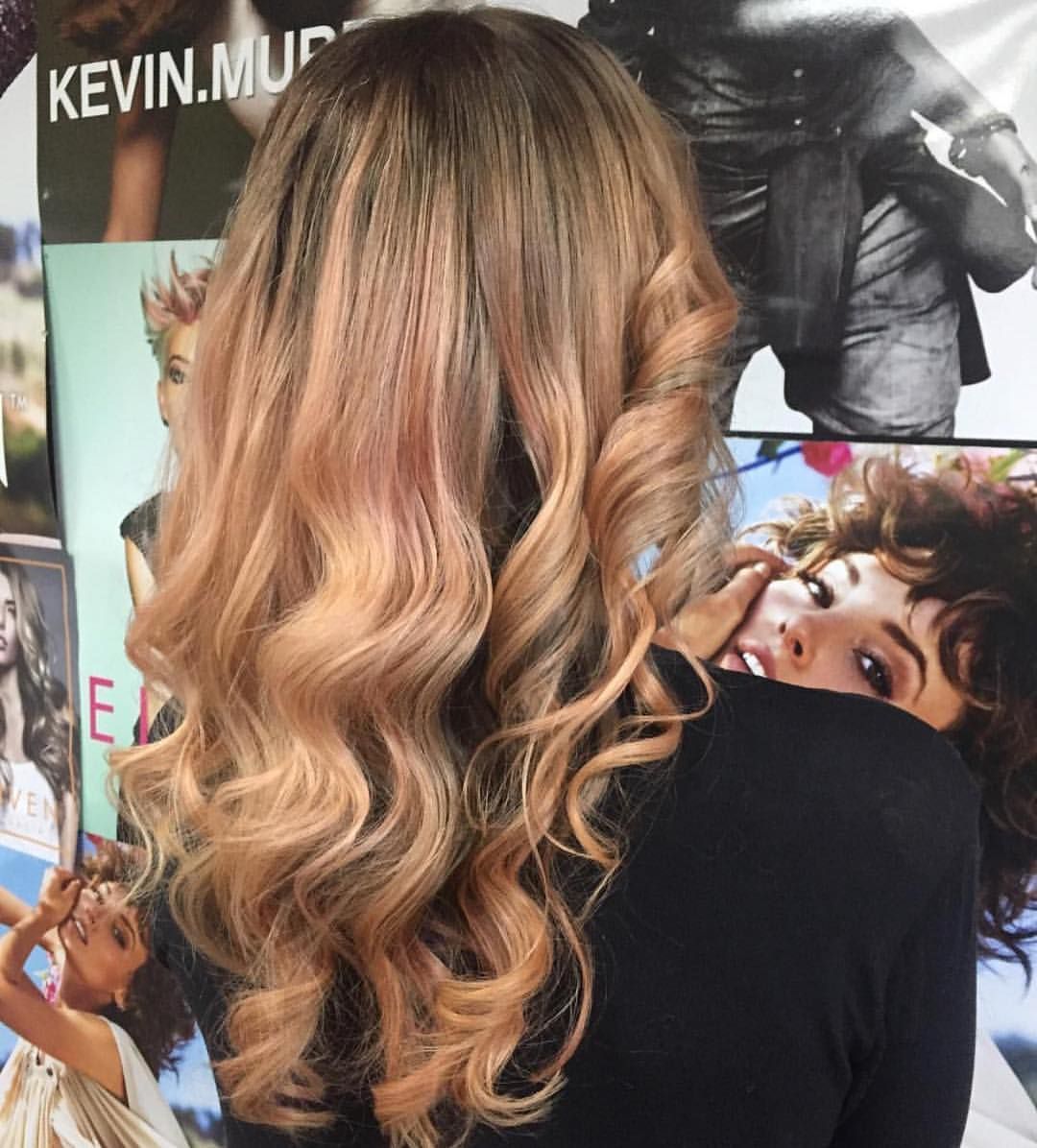 Woman With Wavy, Light Brown and Pink Hair; Standing in Front of Posters — Lavish Hair in Shepparton, VIC