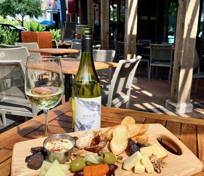 Wine and garlic bread on table