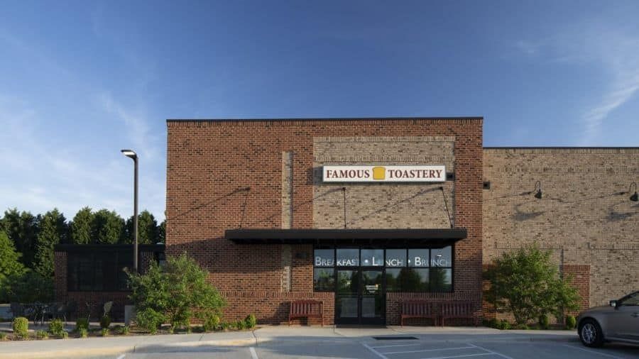 A brick building with a sign that says famous toasters