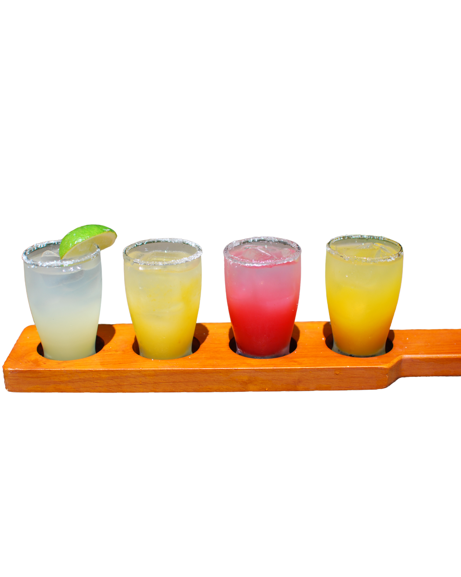 A wooden tray with four shot glasses filled with different colored drinks.