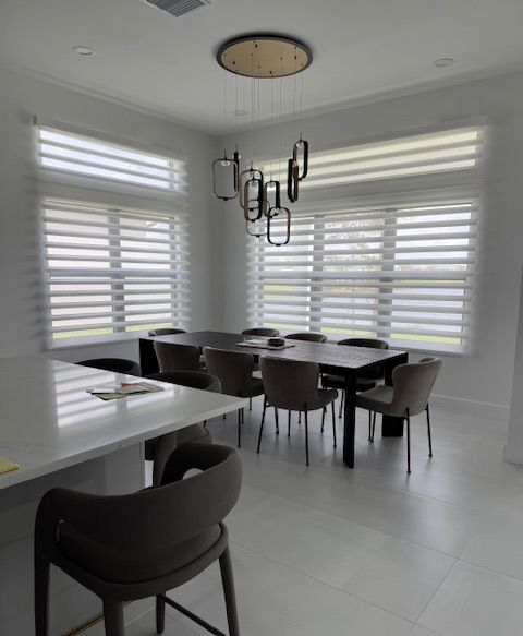 A white dining room area behind a corresponding bar counter 