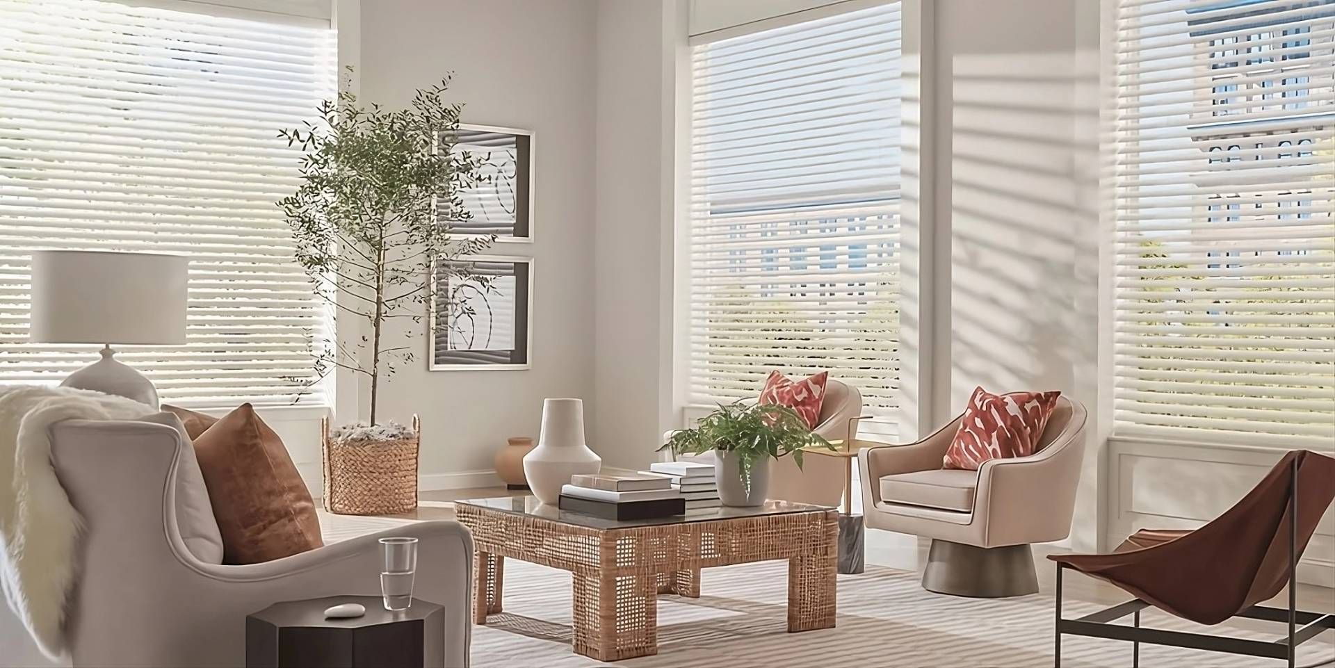 Hunter Douglas Aria™ Soft Blinds on expansive windows in a lovely living room, featuring woven decor
