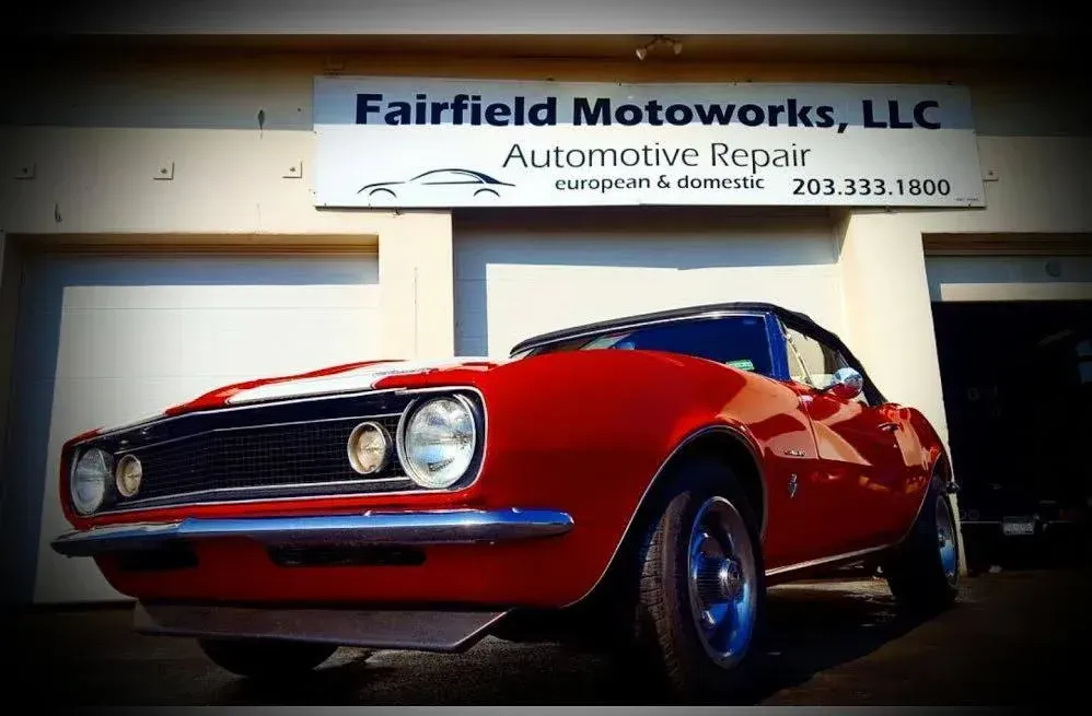 1970's Red Classic Car Parked In Front of Auto Shop | Fairfield Motoworks LLC