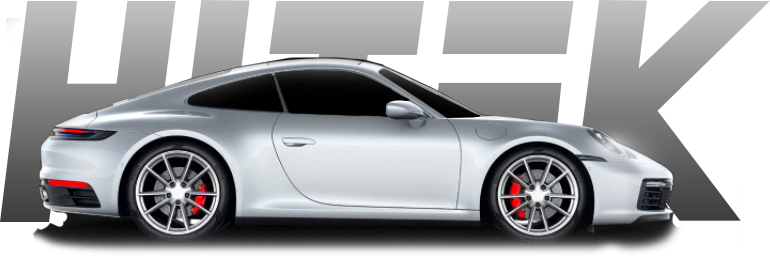 Silver Porsche sports car with red brake calipers, partially obscured by the word 