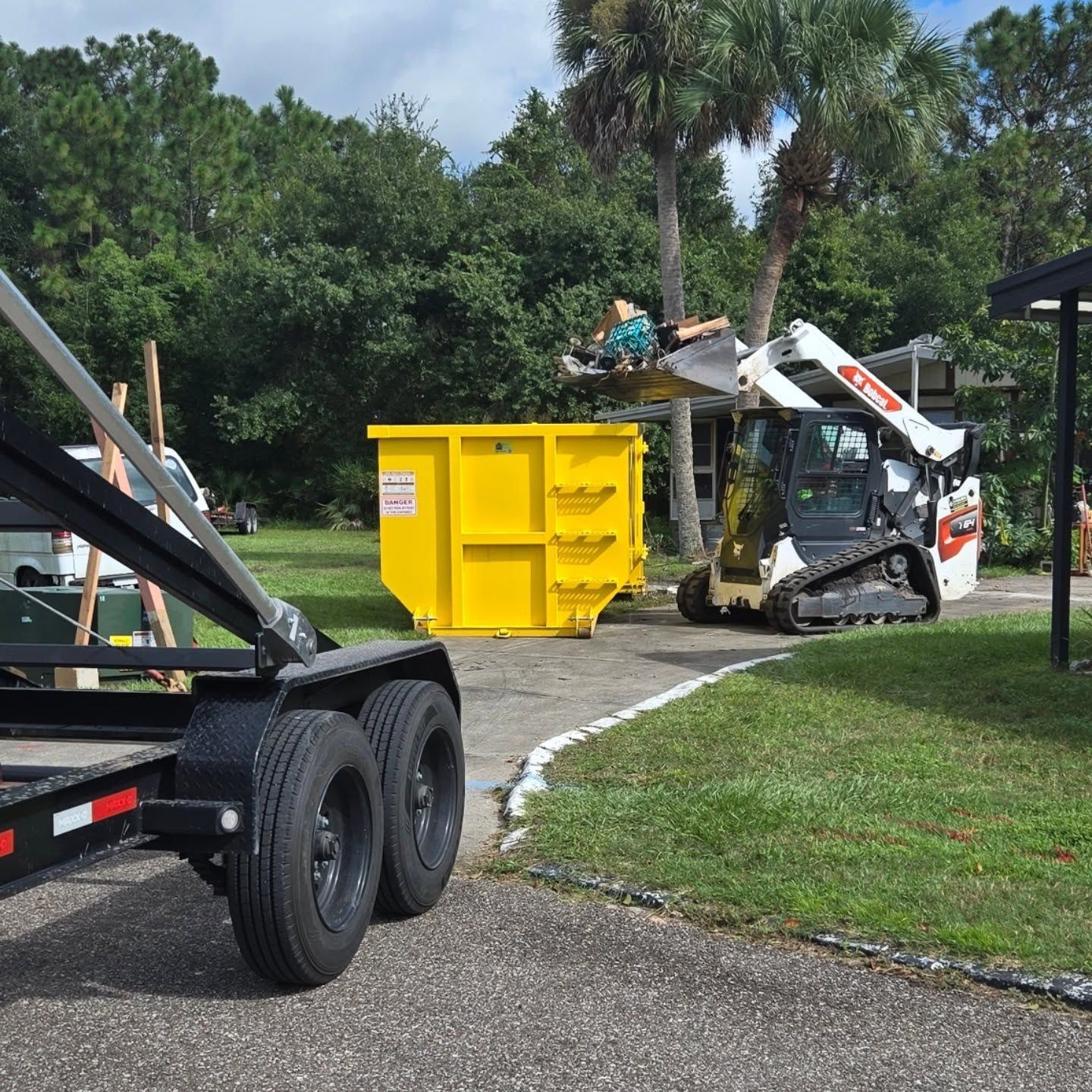 20-yard dumpster on Orlando driveway