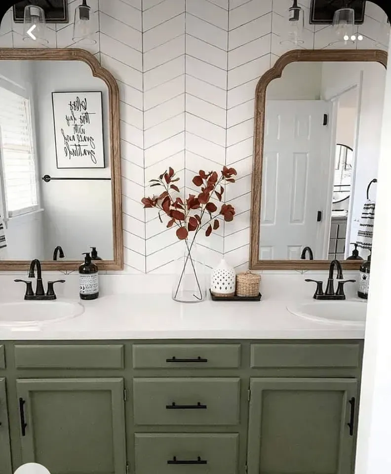 A bathroom with two sinks and two mirrors.