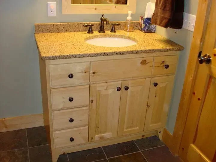 A bathroom vanity with a sink and a mirror