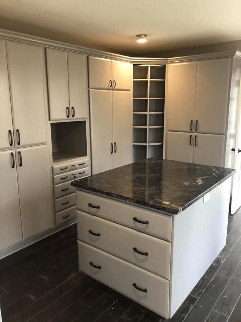 There is a large island in the middle of the kitchen.