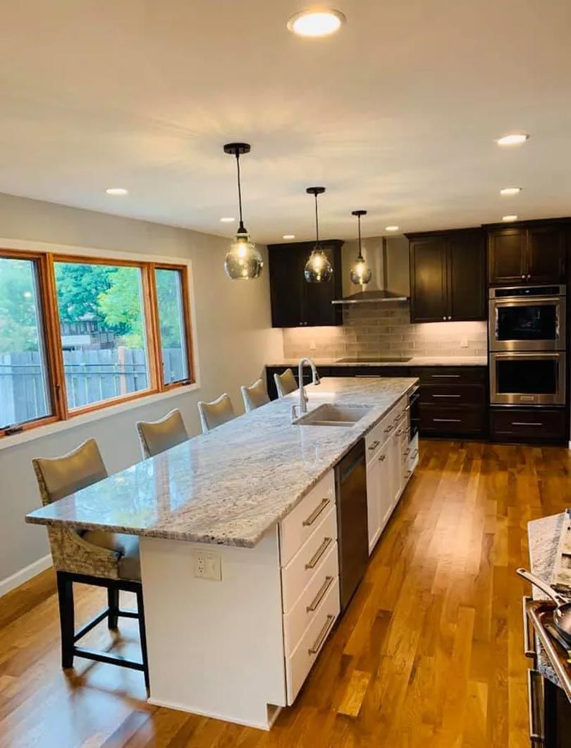 There is a large island in the middle of the kitchen.