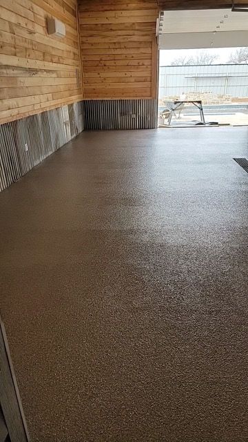 A Garage with A Concrete Floor and A Wooden Wall