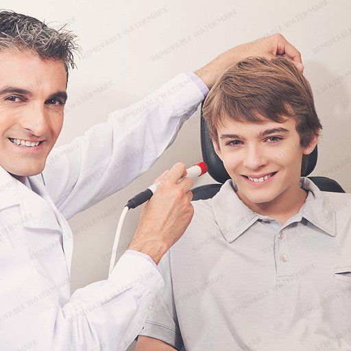 Doctor Checking Boy's Eye