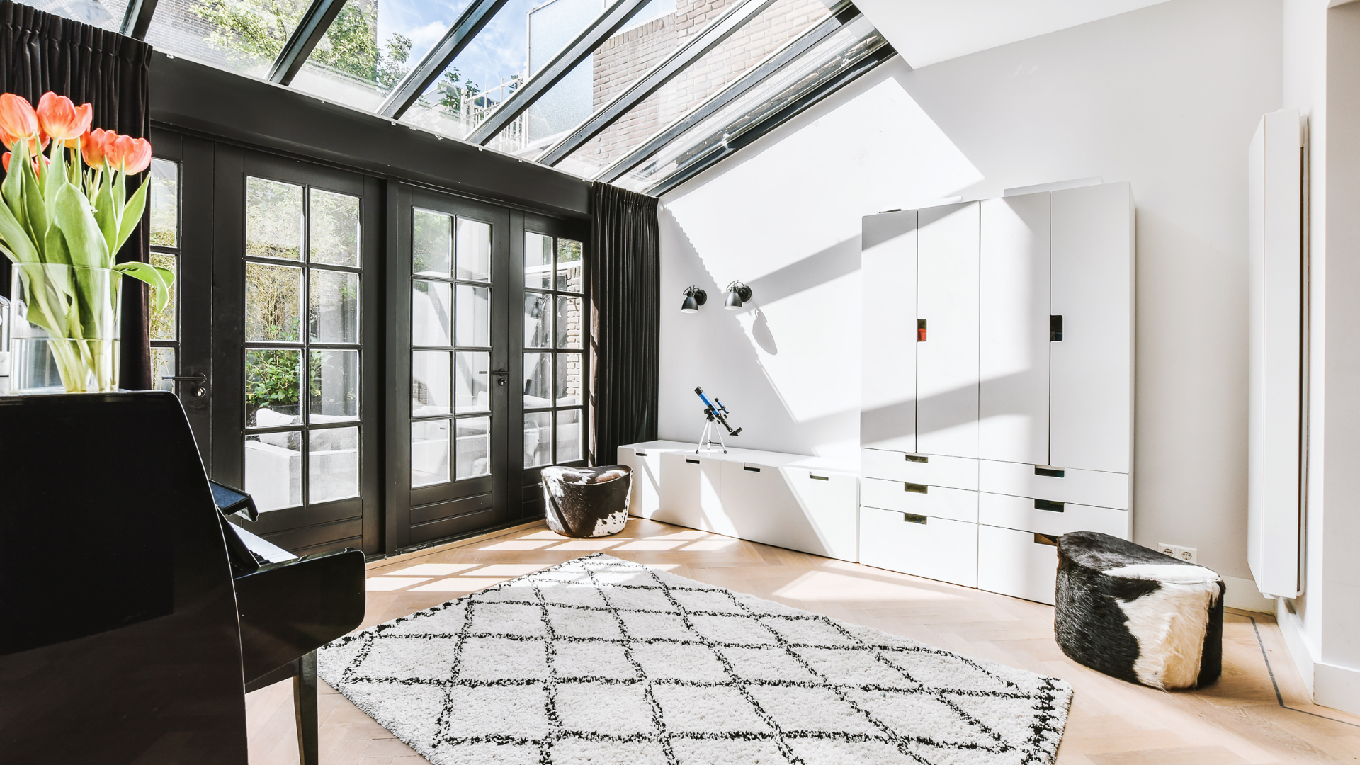 A large house with a large swimming pool in front of it.