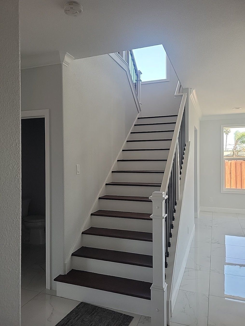 A set of stairs leading up to the second floor of a house.