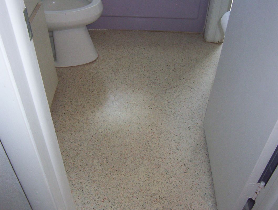 Bathroom floor with speckled beige linoleum