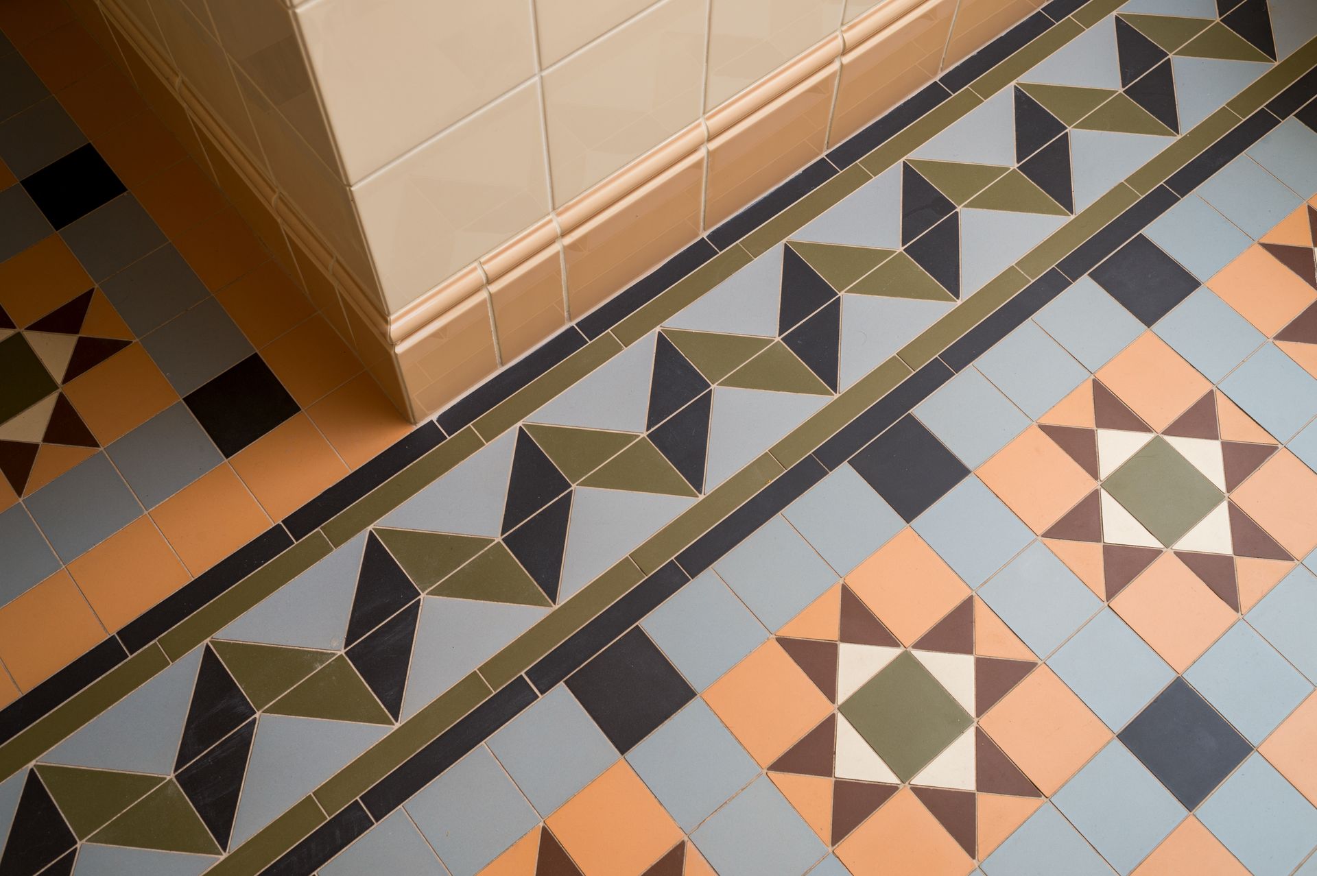 Geometric patterned floor with light and dark tiles