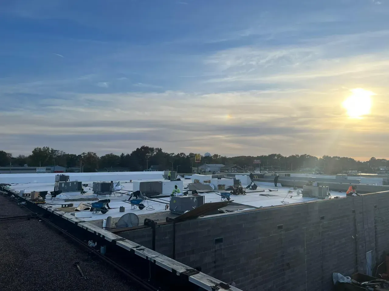 The Sun Is Shining Brightly on The Roof of A Building | Fayetteville, NC | Danny Odom Roofing