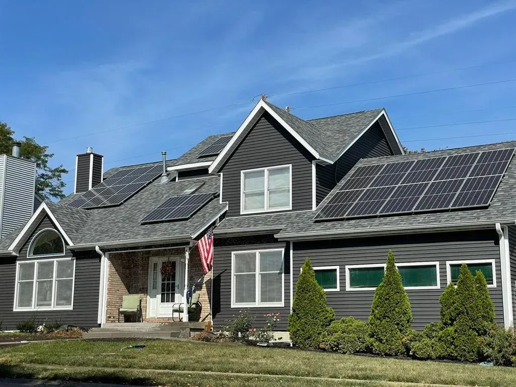 A Large House with Solar Panels on The Roof | Fayetteville, NC | Danny Odom Roofing