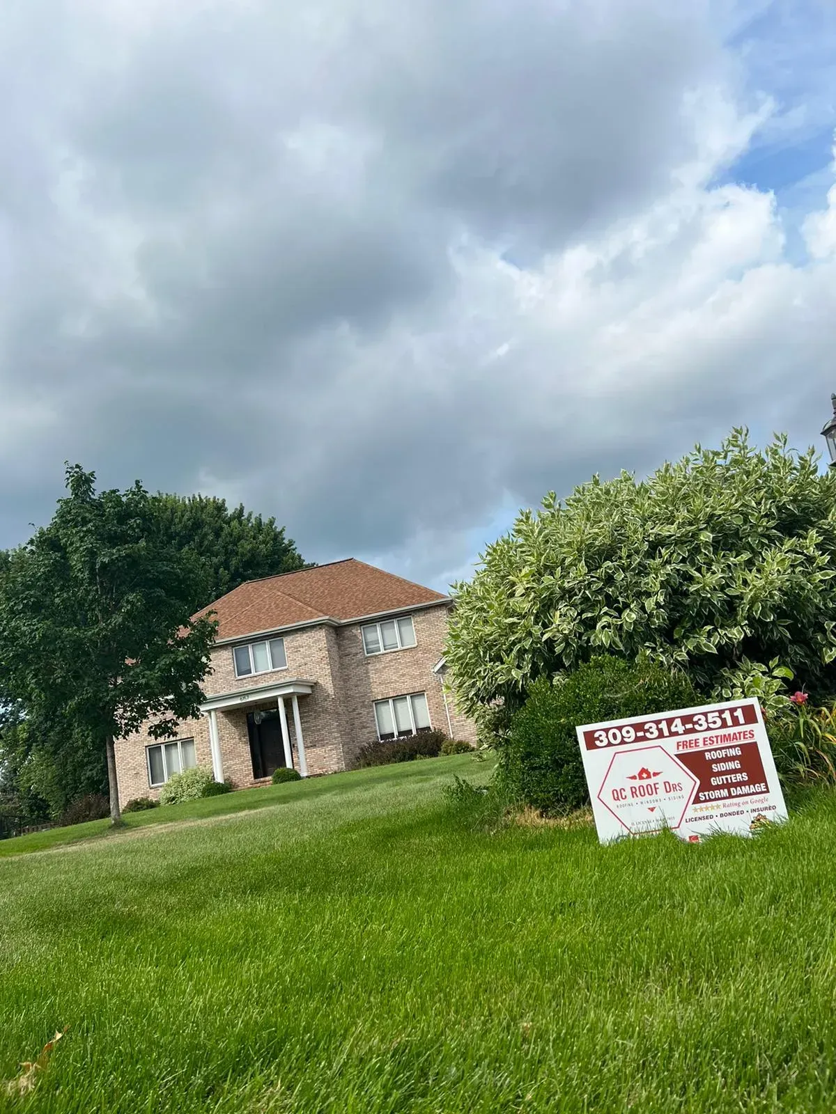 A House with A for Sale Sign in Front of It | Fayetteville, NC | Danny Odom Roofing