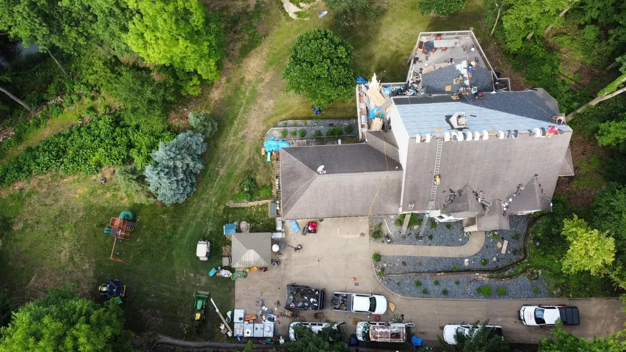 An Aerial View of A Large House Surrounded by Trees | Fayetteville, NC | Danny Odom Roofing