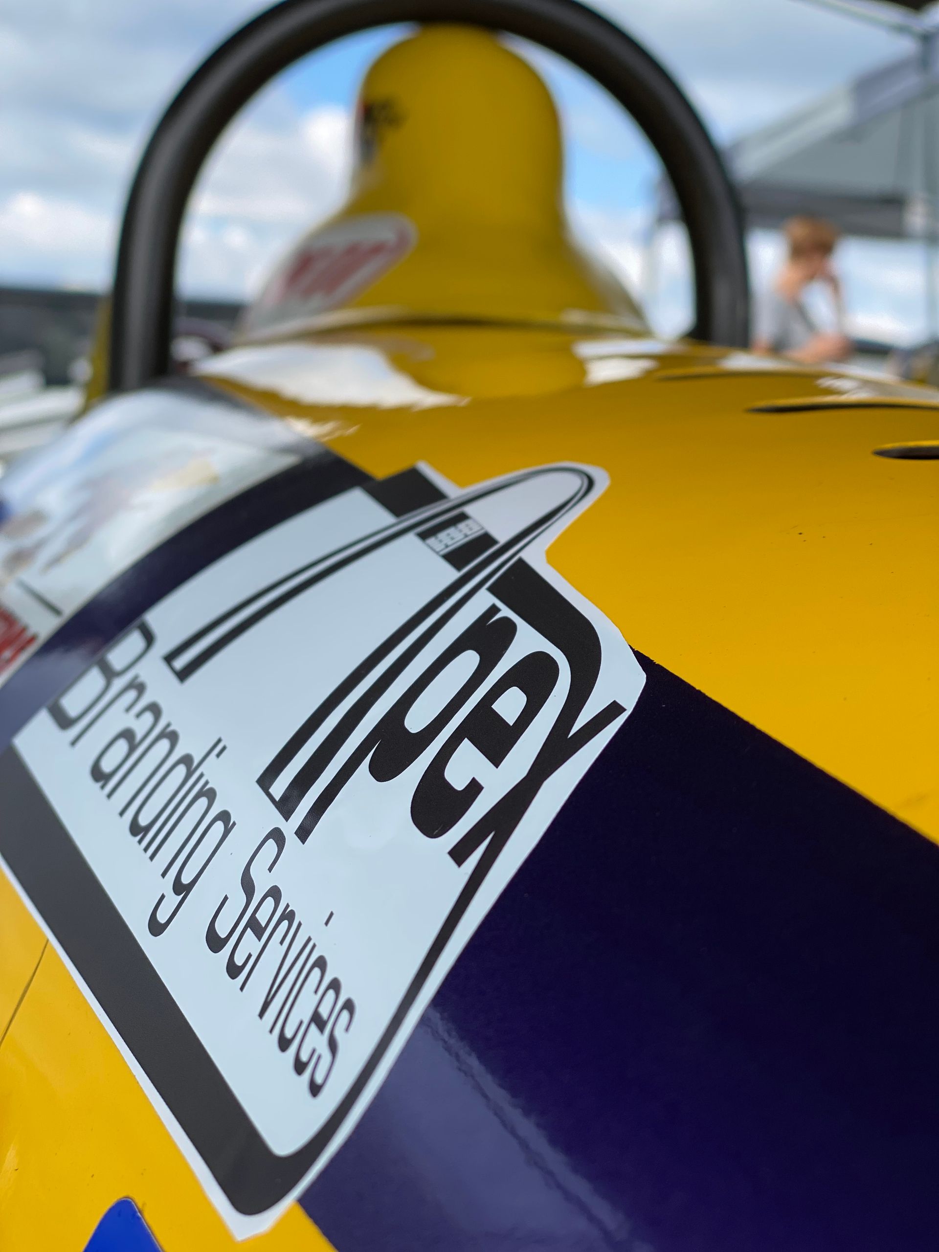 Close-up of a yellow and purple racing car with a