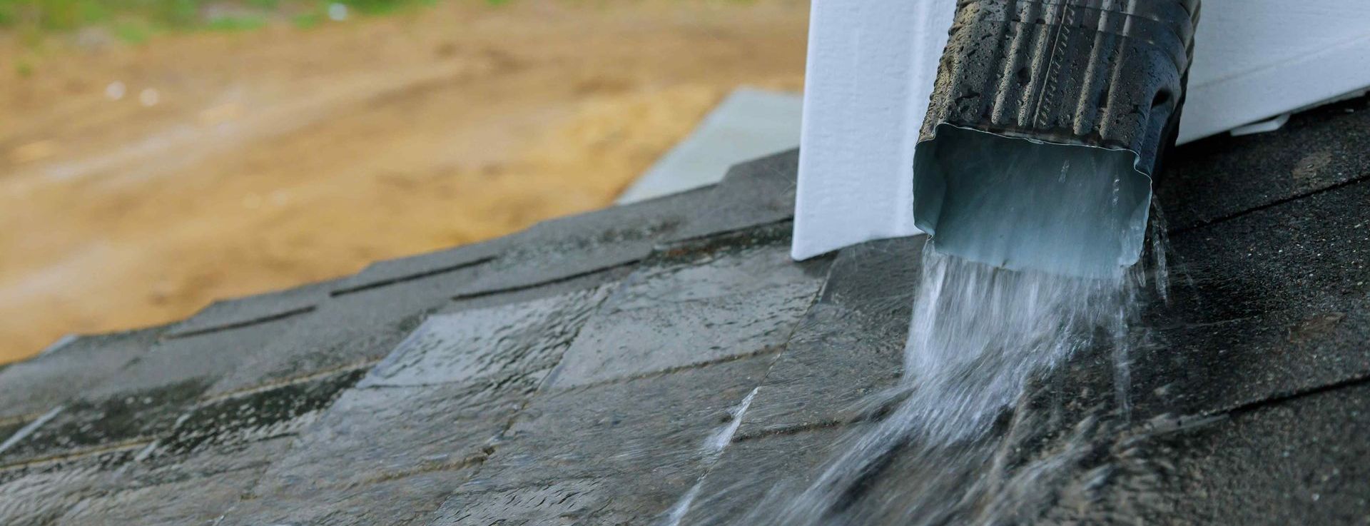 Heavy Rain Through Down Spout Of House