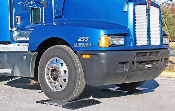 semi truck being weighed on scale