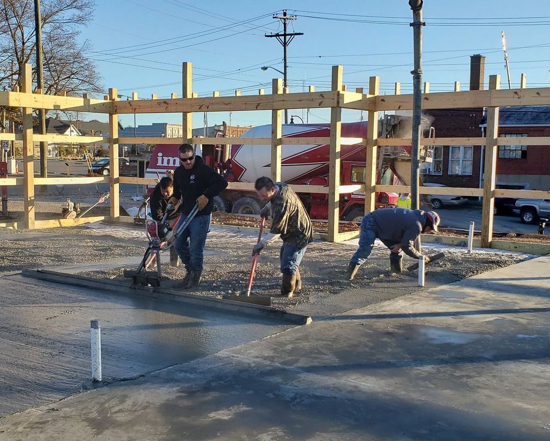 A group of people are working on a construction site.