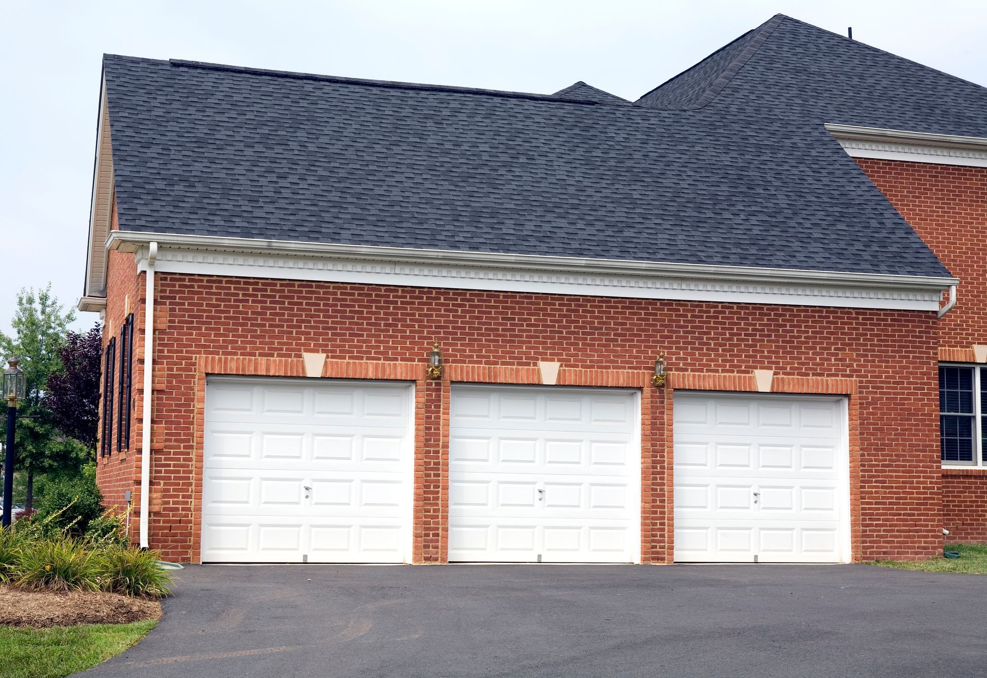 House with white garage doors | Russellville, AR | Mize Garage Doors, Inc.