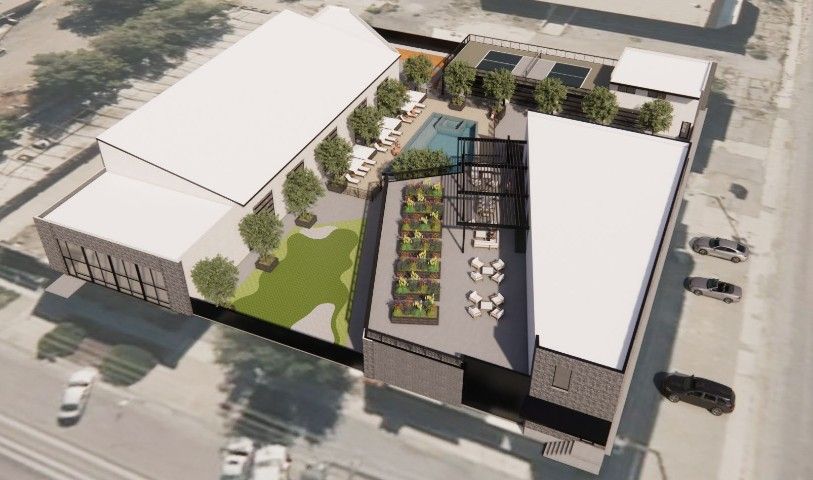 Digital rendering of exterior birdseye view of the SLC Club showing the garden area and building layout.