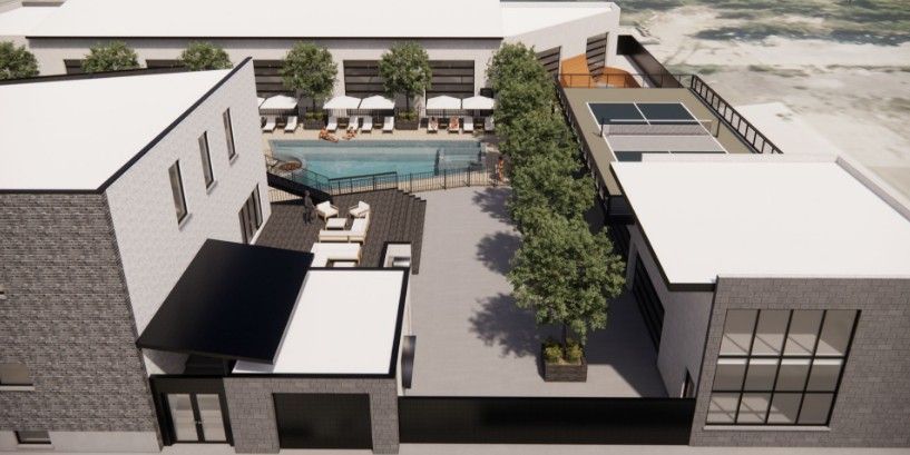 Digital rendering of the exterior of the SLC Club showcasing the front entrance of the building.