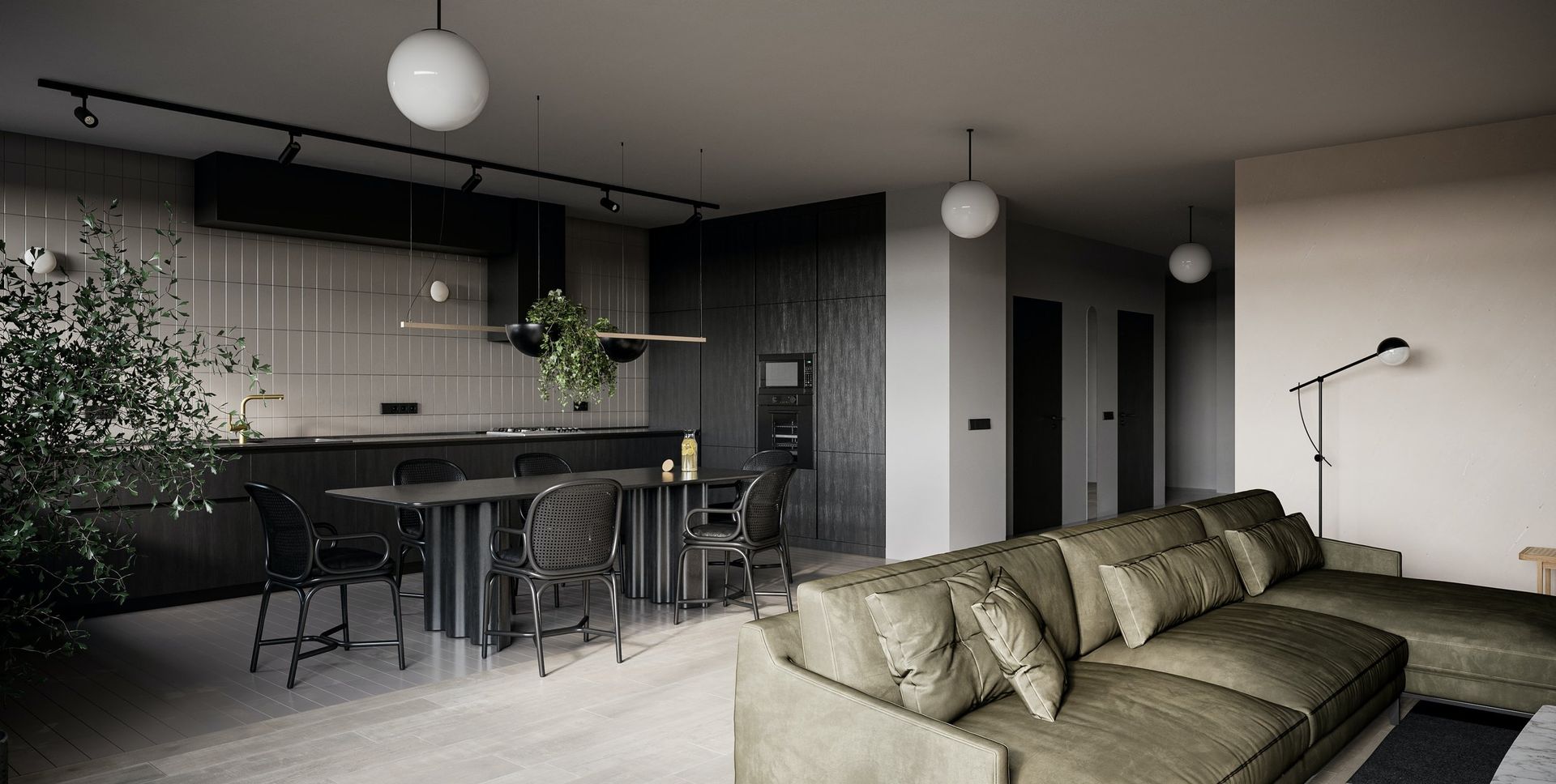 Interior view of black and gray toned kitchen and seating area