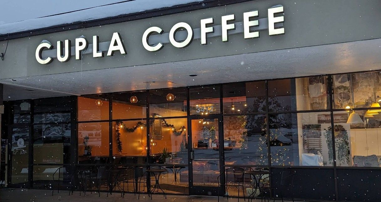 Exterior view of the Cupla Coffee entrance at night