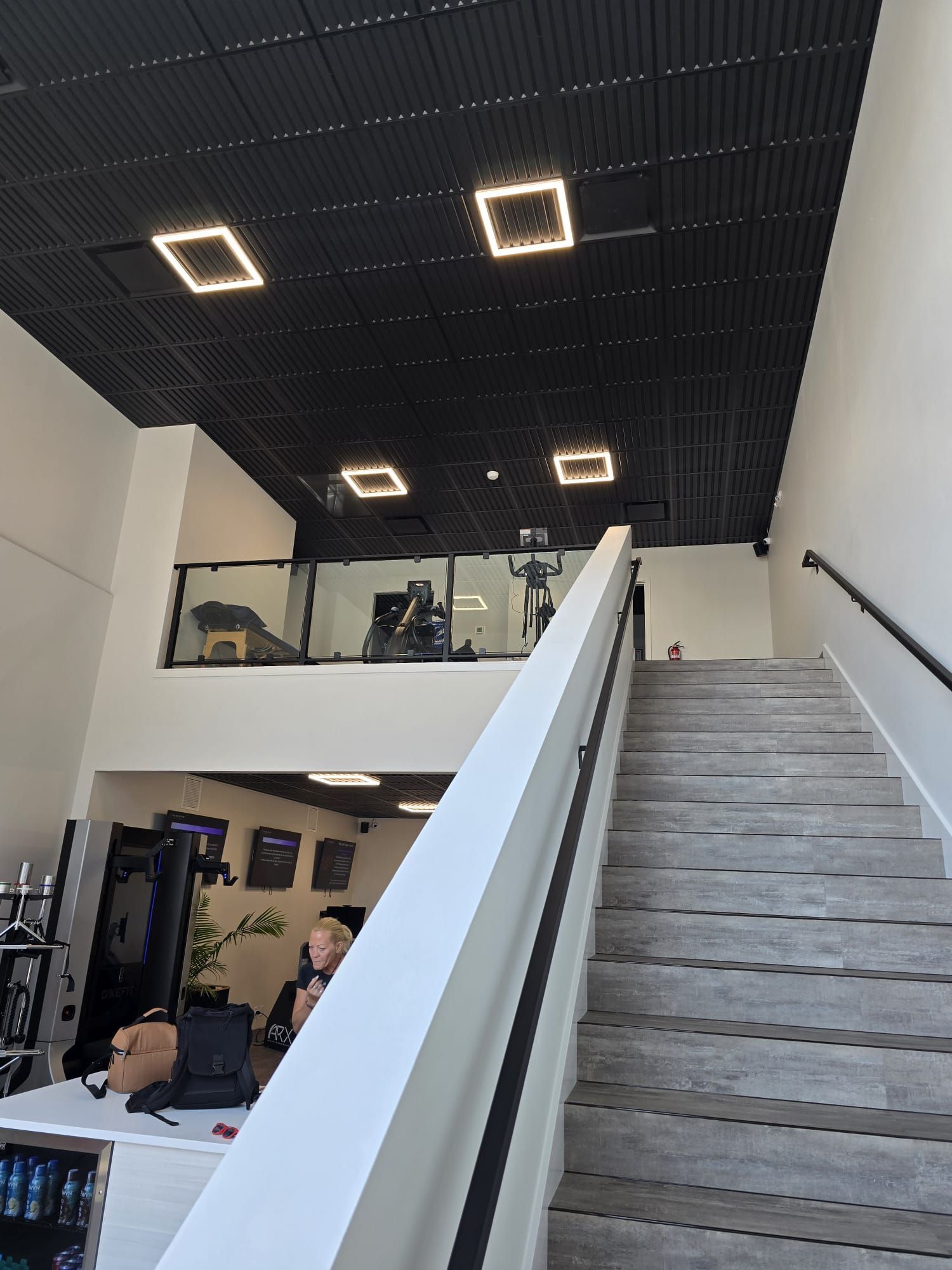Interior view of the staircase leading to second floor of The Smart Fit Method