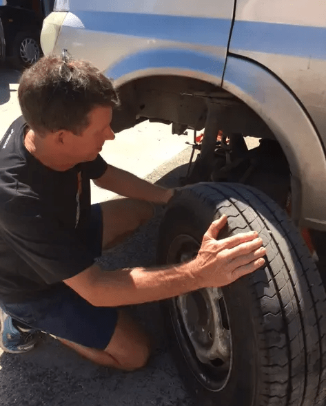 Mechanic Changing Car Tyre — Tyre Repairs & Replacements In Mullumbimby, NSW
